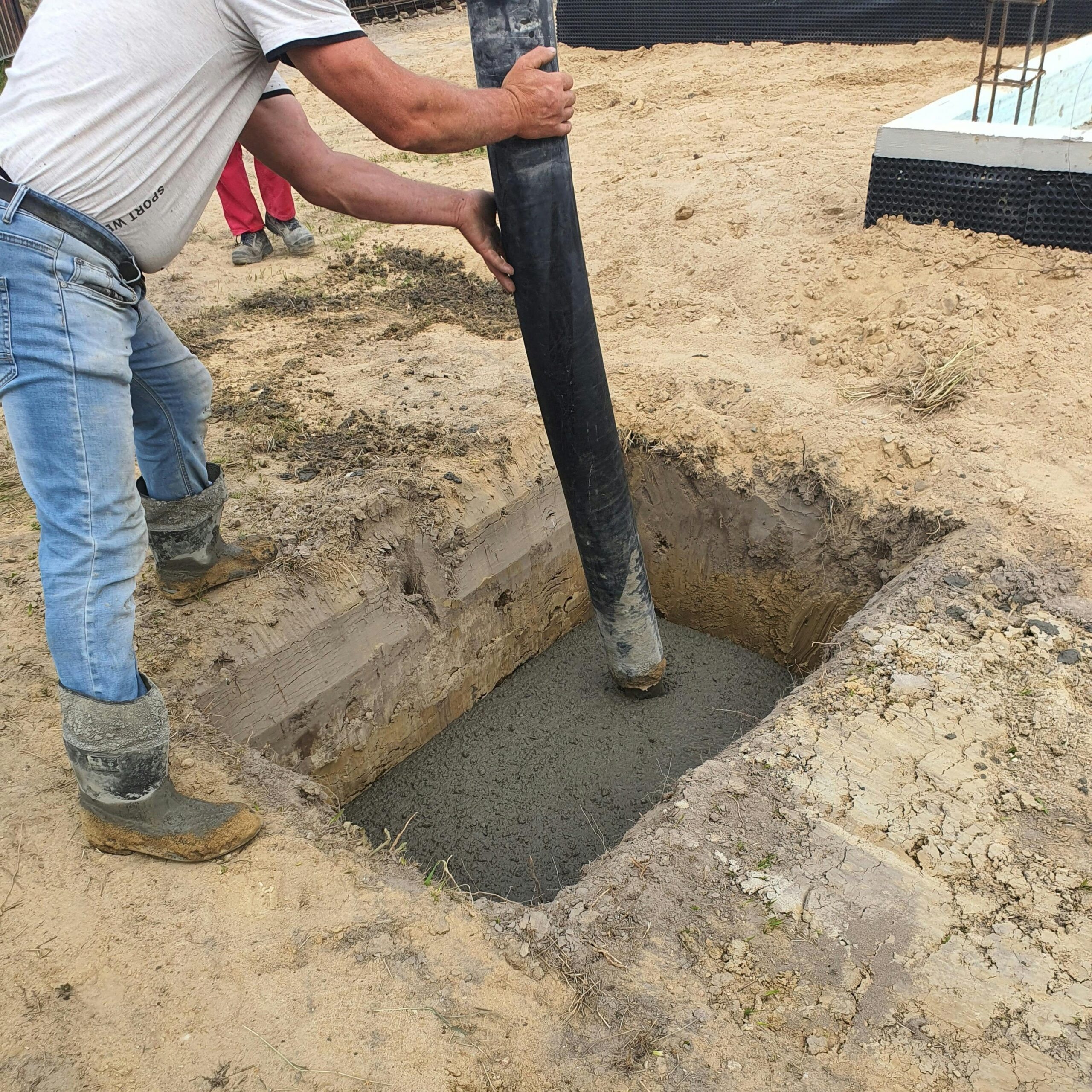 Construction workers preparing a concrete foundation 