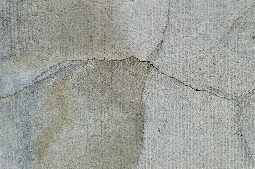 Close-up of shrinkage cracks on a concrete surface