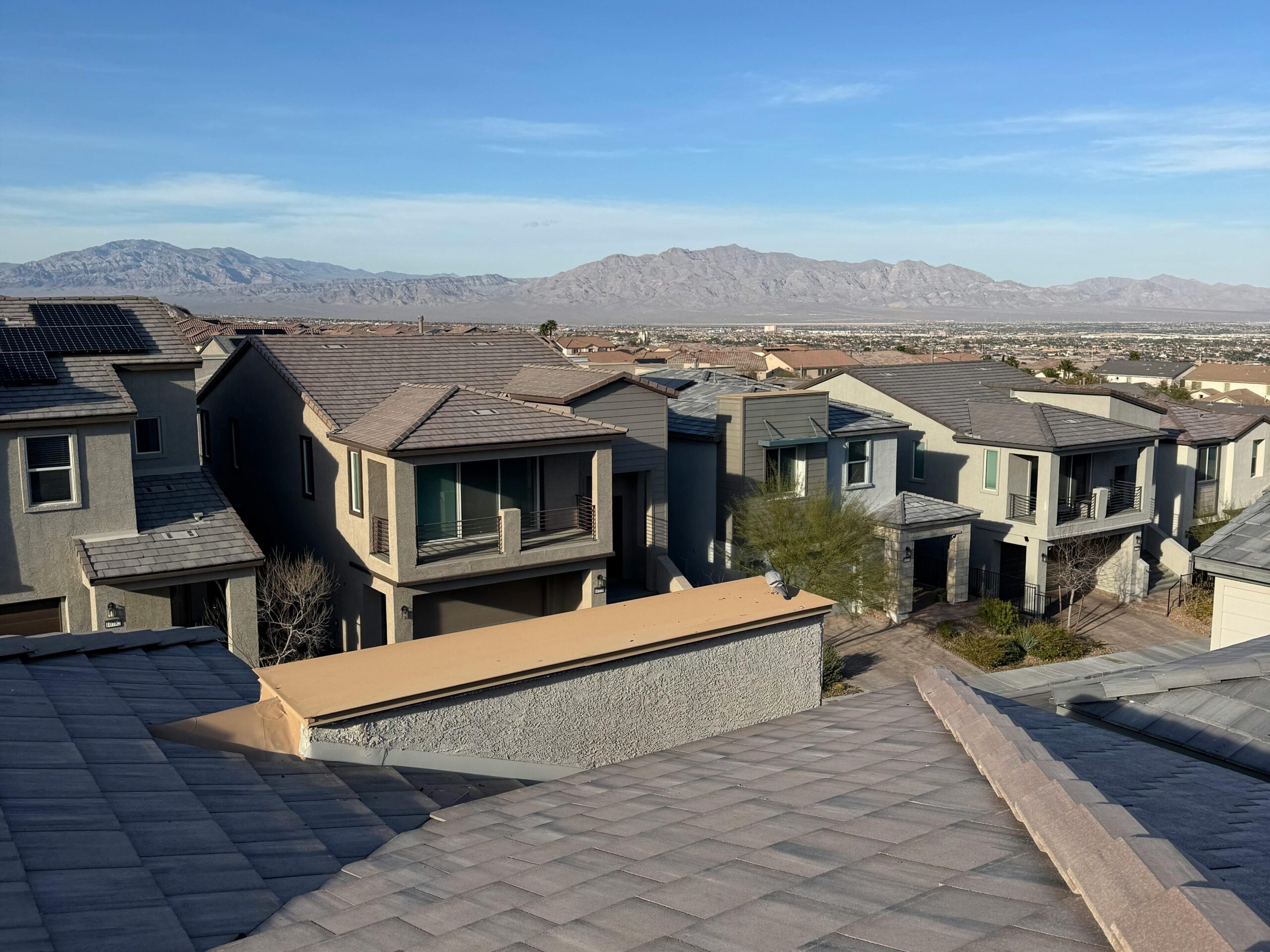 Tile roof on a desert climate home with mountains in the background