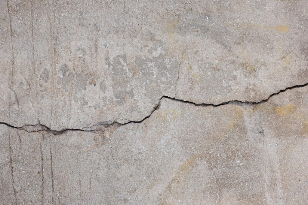 Horizontal crack in concrete wall before carbon fiber foundation repair
