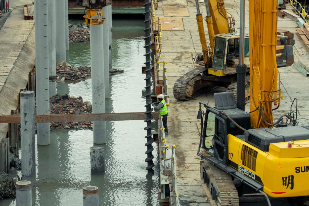 Bored pile construction using rotary drilling equipment for deep foundations near water