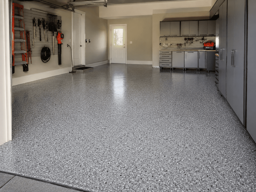 Sealed concrete garage floor with epoxy flake coating and glossy protective finish