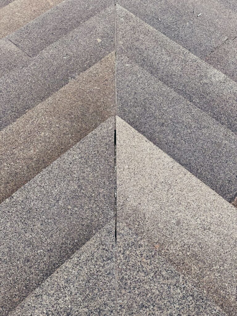 Exposed aggregate concrete stairs with decorative stone texture and saw-cut pattern